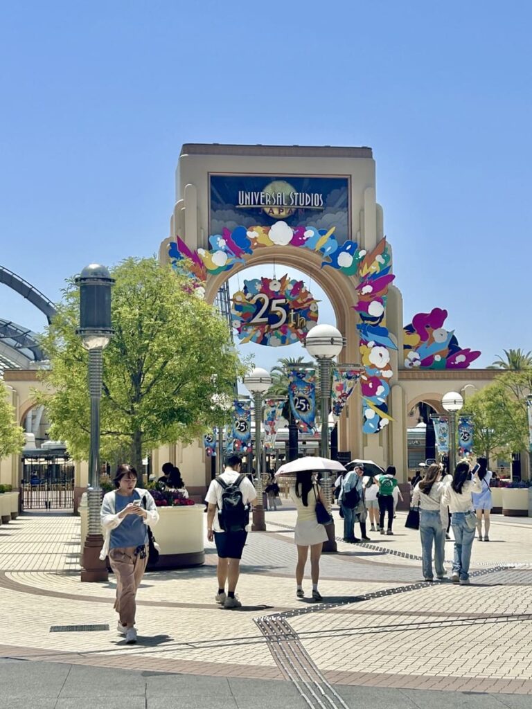 Universal Studios Japan main entrance arch decorated for its 25th anniversary.