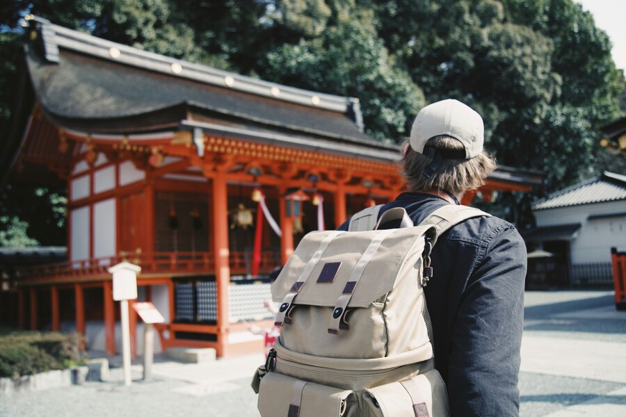 Traveler visiting a Japanese shrine.
