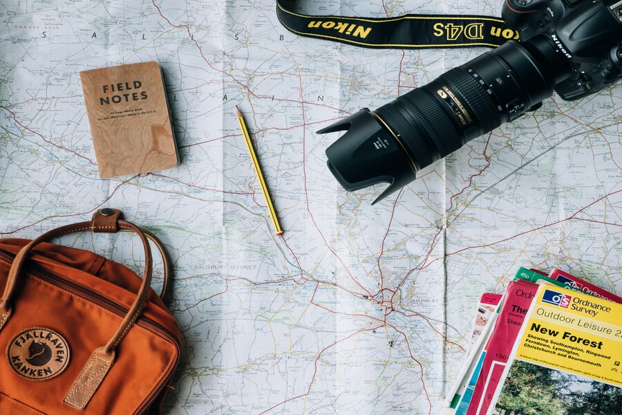 Travel planning with a map and camera.